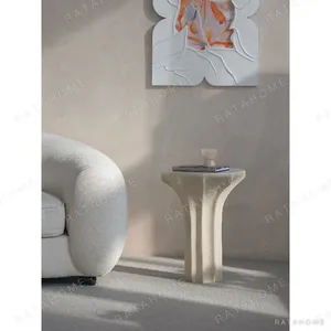 Sculptural Cream Side Table with Arched Forked Base in oatmeal — in a room setting