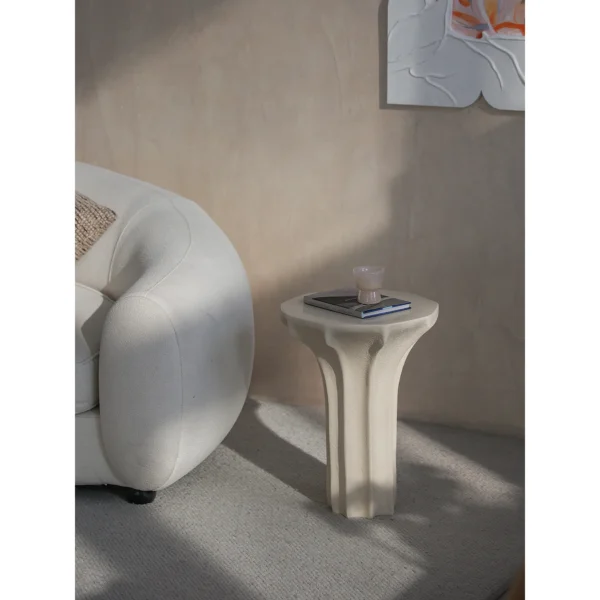 Sculptural Cream Side Table with Arched Forked Base in oatmeal — in a room setting