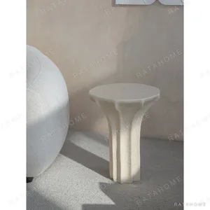 Sculptural Cream Side Table with Arched Forked Base in oatmeal — in a room setting