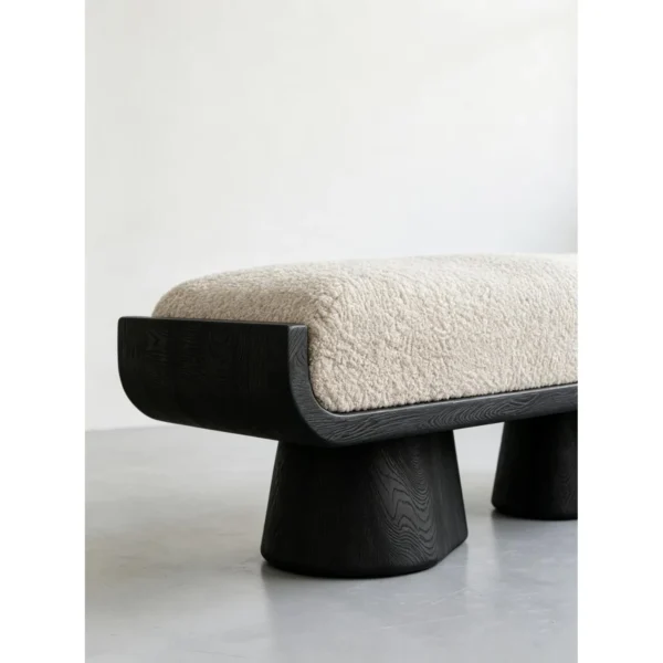 Sculptural Black Oak Bench with Cream Velvet Cushion, 128 cm in black — in a room setting