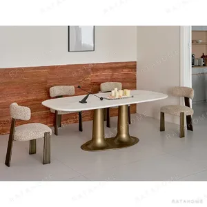 Sculptural Travertine Dining Table in oatmeal — in a room setting
