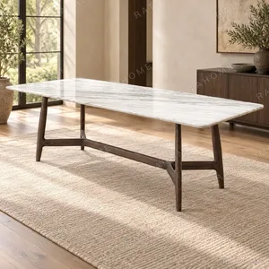 Seito Marble-Top Dining Table on Walnut Sled Legs in ivory — in a room setting