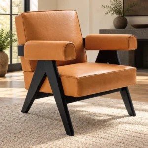 Tan Leather Armchair with Angled Black Wood Frame in clay — in a room setting