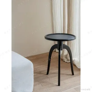 Shinian Black Tripod Side Table with Bird's Eye Top in black — in a room setting