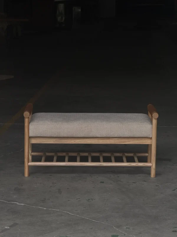 Oak Entryway Bench with Bolster Arms and Slatted Shelf in natural oak — in a room setting