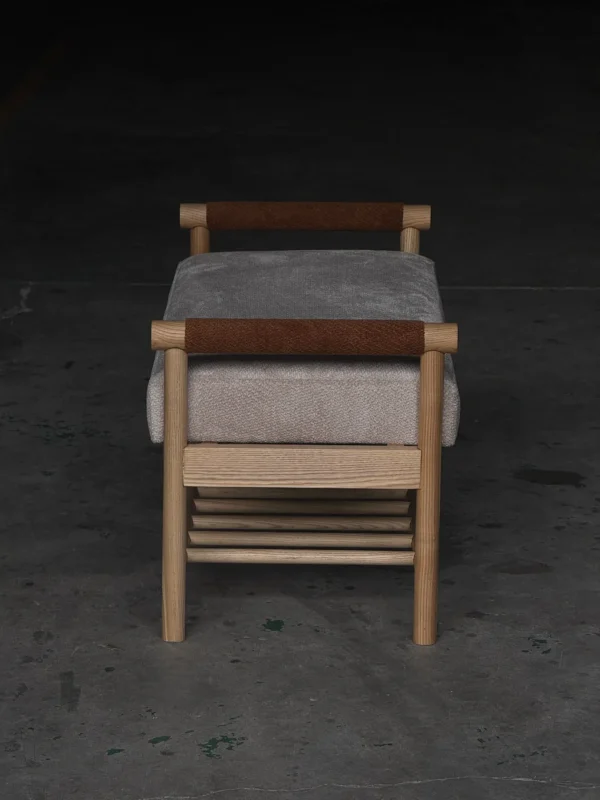 Oak Entryway Bench with Bolster Arms and Slatted Shelf in natural oak — in a room setting