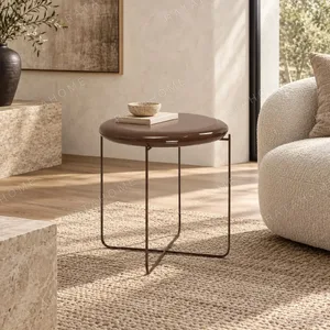 Taoyao Petite Round Side Table on Crossed Metal Frame in clay — in a room setting
