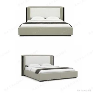 Channel-Tufted Wingback Bed with Black Trim in sand — in a room setting