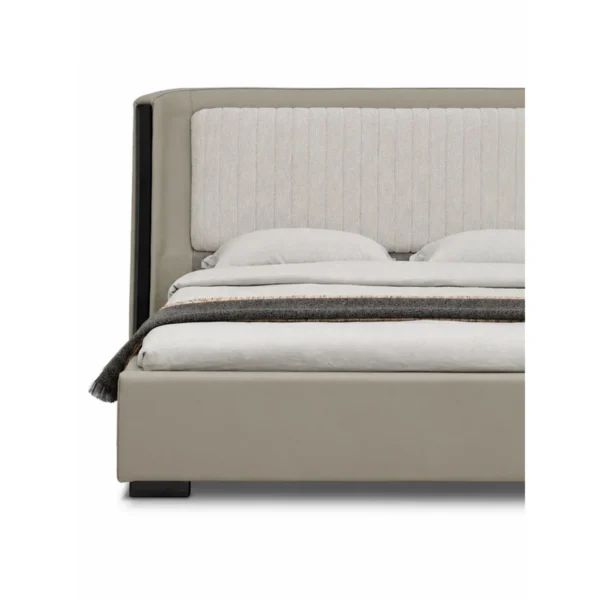 Channel-Tufted Wingback Bed with Black Trim in sand — in a room setting