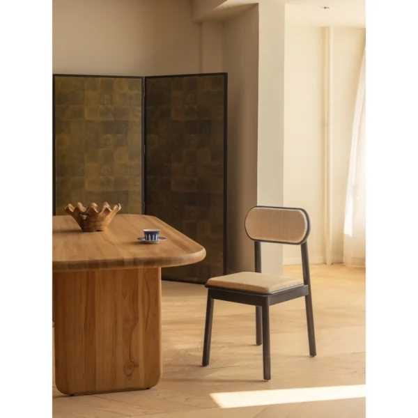 Irwin Black Teak Dining Chair with Cane Seat and Back in black — in a room setting