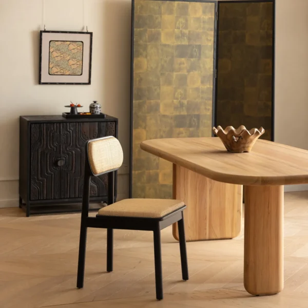 Irwin Black Teak Dining Chair with Cane Seat and Back in black — in a room setting