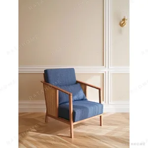 Solid Wood Armchair with Cane Sides in Blue Fabric — in a room setting