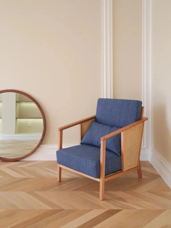 Solid Wood Armchair with Cane Sides in Blue Fabric — in a room setting
