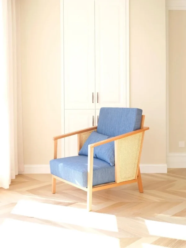 Solid Wood Armchair with Cane Sides in Blue Fabric — in a room setting