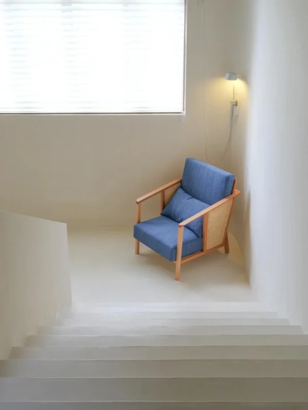 Solid Wood Armchair with Cane Sides in Blue Fabric — in a room setting