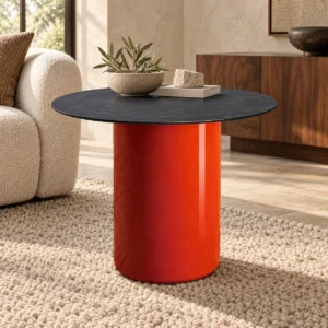 Orange Cylinder Side Table with Black Stone Top in rust — front view