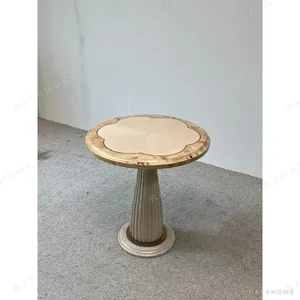 Scalloped Round Side Table on Fluted Cream Pedestal in oatmeal — in a room setting