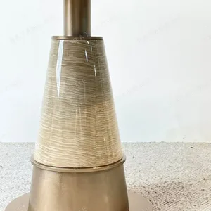 White Stone Round Table on Textured Brass Cone Base in ivory — detail