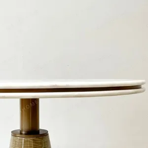 White Stone Round Table on Textured Brass Cone Base in ivory — detail