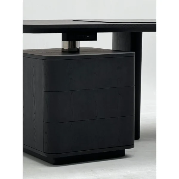 Smoked Black Ash Curved Desk in black — in a room setting