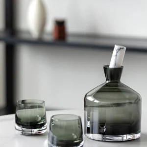 Smoked Green Glass Decanter and Whisky Tumbler Set in olive — in a room setting