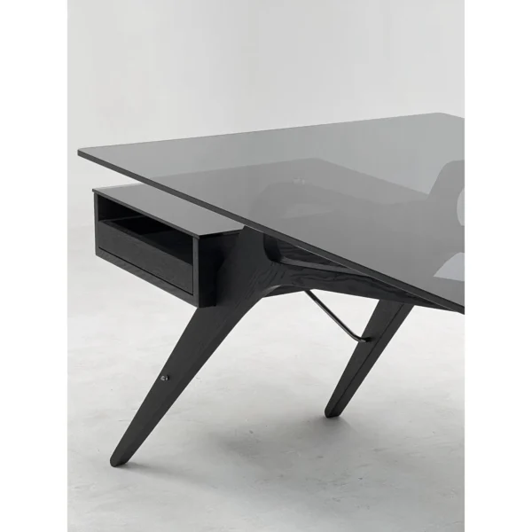 Smoked Wood Wing-Frame Desk in black — in a room setting