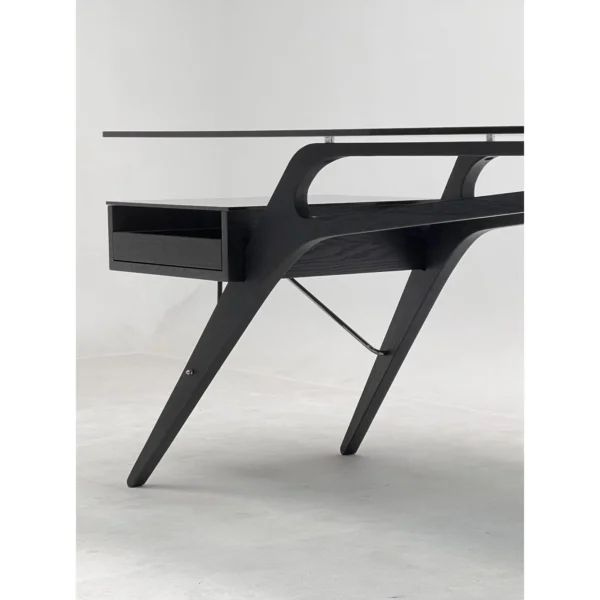 Smoked Wood Wing-Frame Desk in black — in a room setting
