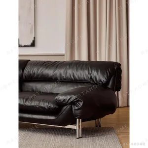Snow Top Down-Filled Leather Sofa with Eastern Eave Lines in black — in a room setting