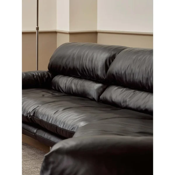 Snow Top Down-Filled Leather Sofa with Eastern Eave Lines in black — in a room setting