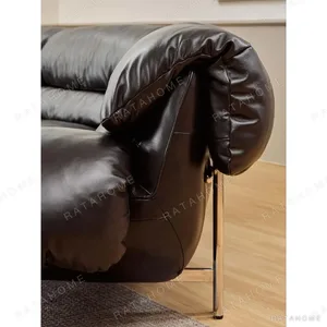 Snow Top Down-Filled Leather Sofa with Eastern Eave Lines in black — in a room setting
