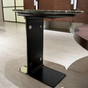 Green Marble Hexagonal Side Table on Black Cantilever Base in olive — in a room setting