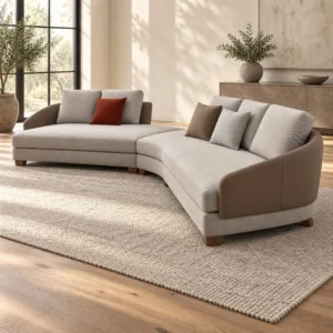 Grey Curved Sectional with Angled Chaise on Wood Base in slate — in a room setting