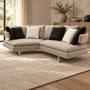 Cream Angled Sectional with Loose Cushions on Metal Base in oatmeal — in a room setting