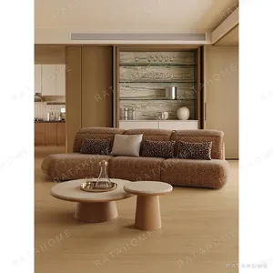 Soft Edge Armless Sofa in rust — in a room setting