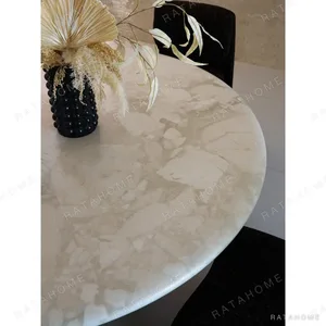 Soft-Light Travertine Round Table in oatmeal — in a room setting