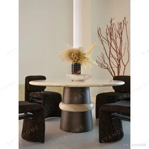 Soft-Light Travertine Round Table in oatmeal — in a room setting