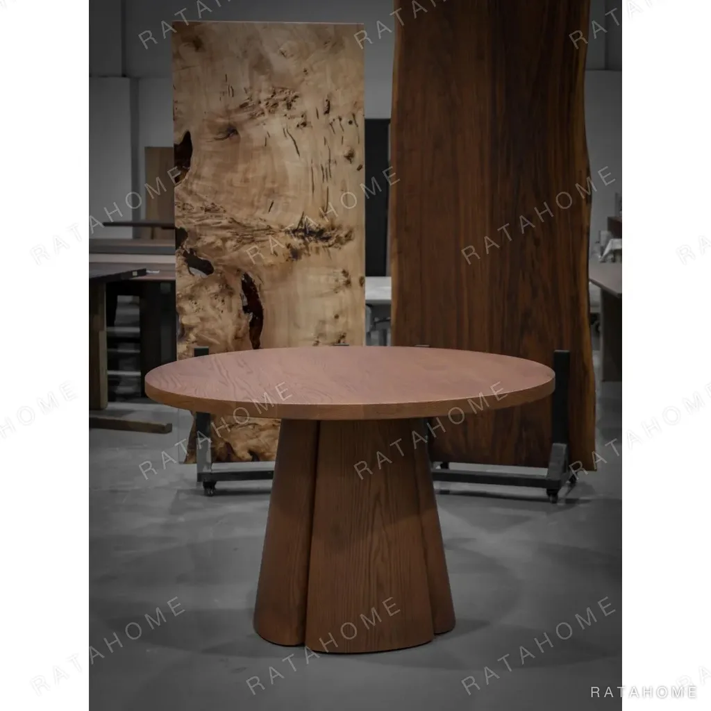 Soft-Line Round Dining Table on Fluted Petal Base in clay — in a room setting