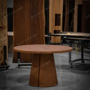 Soft-Line Round Dining Table on Fluted Petal Base in clay — in a room setting