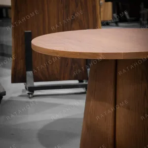 Soft-Line Round Dining Table on Fluted Petal Base in clay — detail