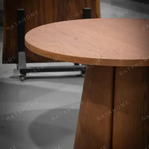 Soft-Line Round Dining Table on Fluted Petal Base in clay — detail