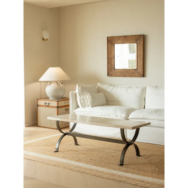 Mid-Century Stone Top Coffee Table on Curved Metal Base in oatmeal — in a room setting