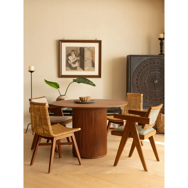 Mango Wood Round Dining Table on Fluted Drum Base in clay — in a room setting