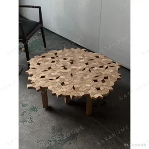 Solid Wood Carved Patchwork Coffee Table in natural oak — in a room setting