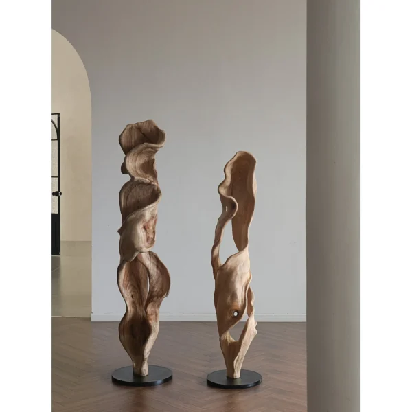 Hand-Carved Camphor Wood Twisting Floor Sculpture in natural oak — in a room setting
