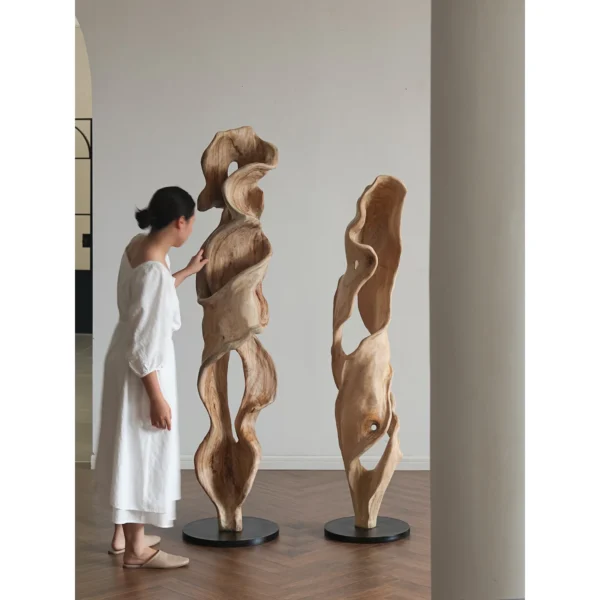 Hand-Carved Camphor Wood Twisting Floor Sculpture in natural oak — in a room setting
