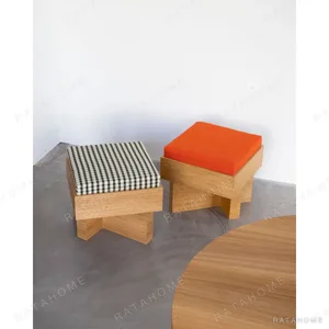 Solid Oak Low Stool with Gingham or Orange Cushion in natural oak — in a room setting