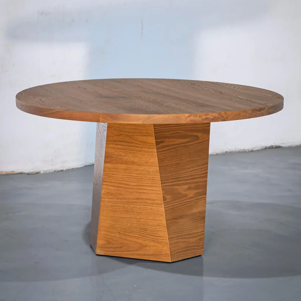 Solid Wood Round Dining Table on Angular Pedestal in clay — front view