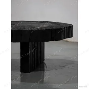 Charred Solid Wood Live Edge Coffee Table with Brass Inlay in black — in a room setting