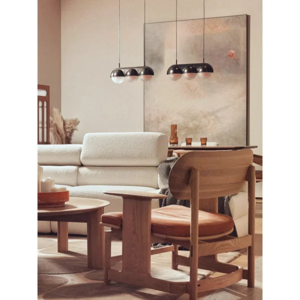 Smile Oak Lounge Chair with Curved Back and Side Tray in natural oak — in a room setting