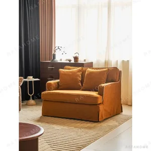 Souffle Slipcovered Sofa in olive — in a room setting